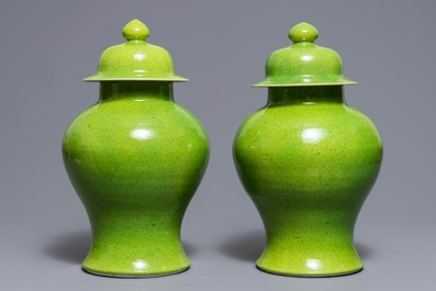 A pair of Chinese yellow and green-glazed vases and covers, 19th C.