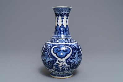 A Chinese blue and white bottle vase, Kangxi mark, 19th C.