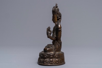 A Sino-Tibetan gilt bronze figure of the four-armed Avalokiteshvara, 18th C.