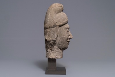 A Chinese carved stone head of a guardian, Ming