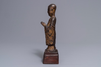 A Chinese lacquered and gilt bronze figure of Mahakasyapa, Ming