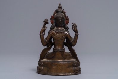 A Sino-Tibetan gilt bronze figure of the four-armed Avalokiteshvara, 18th C.