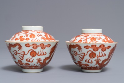 A pair of Chinese iron red and gilt dragon bowls and covers, Guangxu mark, 19/20th C.