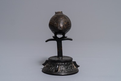 A Chinese bronze water dropper in the shape of a perched bird, Ming