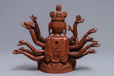 A Chinese huangyang wood figure of the 12-armed Guanyin, Republic, 20th C.