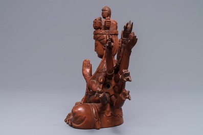 A Chinese huangyang wood figure of the 12-armed Guanyin, Republic, 20th C.