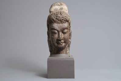 A Chinese carved limestone head of Buddha, Northern Wei (386-535)