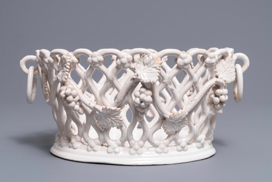 A white-glazed reticulated 'grape vines' basket, France or Italy, 19th C.