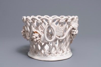 A white-glazed reticulated 'grape vines' basket, France or Italy, 19th C.