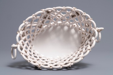 A white-glazed reticulated 'grape vines' basket, France or Italy, 19th C.