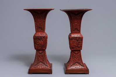 A pair of large Chinese carved cinnabar lacquer 'gu' vases, 18/19th C.