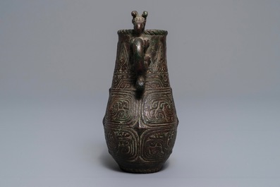 An archaic Chinese relief-decorated two-handled bronze vase, 19th C.