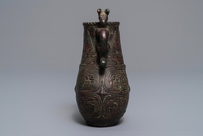 An archaic Chinese relief-decorated two-handled bronze vase, 19th C.