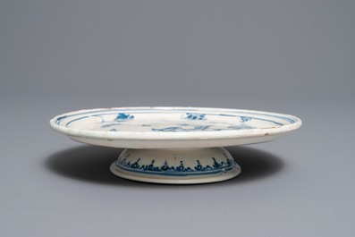 An Alcora faience blue and white tazza with birds and insects, Spain, 18th C.