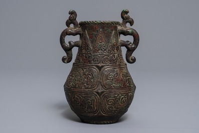 An archaic Chinese relief-decorated two-handled bronze vase, 19th C.