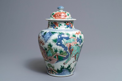 A Chinese wucai &lsquo;mythical beasts&rsquo; vase and cover, Transitional period