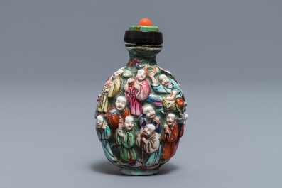 A Chinese famille rose relief-decorated snuff bottle, 19th C.