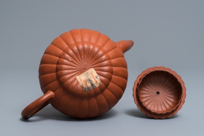 A Chinese Yixing stoneware 'chrysanthemum' teapot and cover, Kangxi