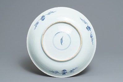 A Chinese blue and white 'aster' dish and a 'peony scroll' vase, Kangxi and 19th C.