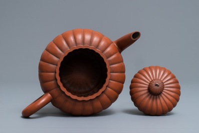 A Chinese Yixing stoneware 'chrysanthemum' teapot and cover, Kangxi