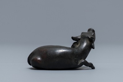 A Chinese bronze water dropper in the shape of a buffalo, two-character mark, Ming