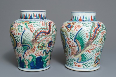 A pair of Chinese wucai &lsquo;dragon and phoenix&rsquo; vases, Transitional period