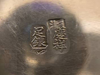 A Chinese silver relief-decorated bowl, marked Qing Xiang, 19/20th C.