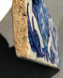 A bichrome Iznik border tile with saz leaves, cloud bands and a rosette, Turkey, 2nd quarter 16th C.