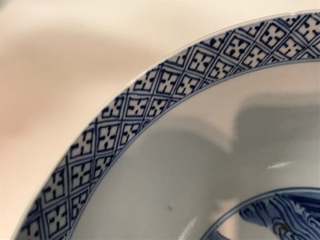 A Chinese blue and white bowl with floral and narrative panels, Kangxi mark and of the period