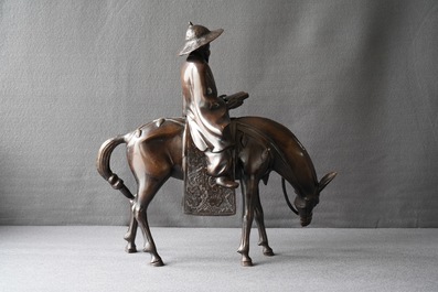 Een grote Japanse bronzen groep van een wijze te paard, Meiji, 19e eeuw