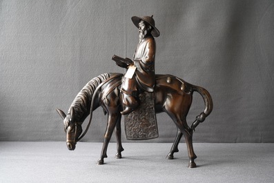 A large Japanese bronze group of a sage on horseback, Meiji, 19th C.