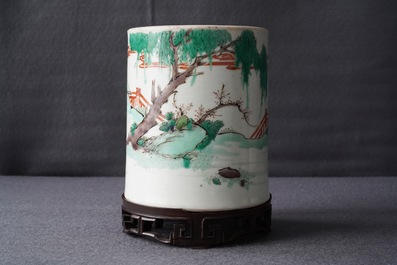 A Chinese famille verte brush pot on wooden stand, Kangxi