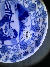 Two Chinese blue and white moulded plates with figures, Kangxi mark and of the period