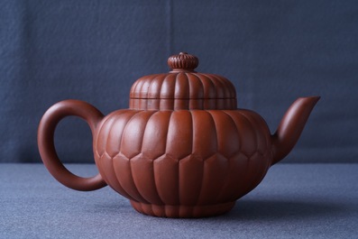 A Chinese Yixing stoneware 'chrysanthemum' teapot and cover, Kangxi