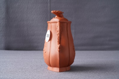 A Chinese Yixing stoneware wine jug with applied flowers and buffalo, Kangxi