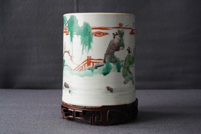 A Chinese famille verte brush pot on wooden stand, Kangxi