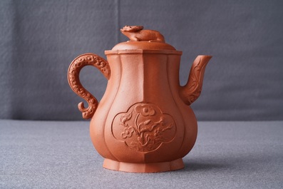 A Chinese Yixing stoneware wine jug with applied flowers and buffalo, Kangxi