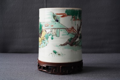 A Chinese famille verte brush pot on wooden stand, Kangxi