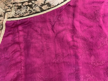 A Chinese informal Manchu embroidered silk pink-ground women's robe, 19th C.