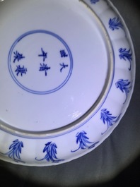 Two Chinese blue and white moulded plates with figures, Kangxi mark and of the period