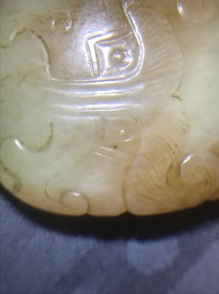 Un pendentif en jade rouille &agrave; inscription 'Charme du tigre', 19/20&egrave;me