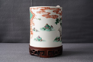 A Chinese famille verte brush pot on wooden stand, Kangxi