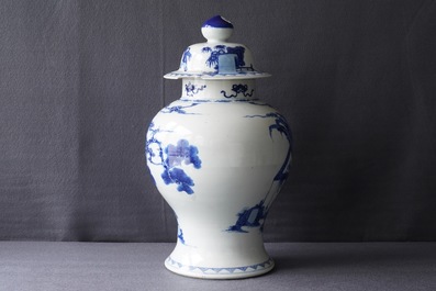 A Chinese blue and white vase and cover with ladies in a garden, 19th C.