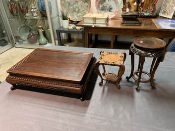 A collection of 22 Chinese wooden stands and one in bronze, 19/20th C.