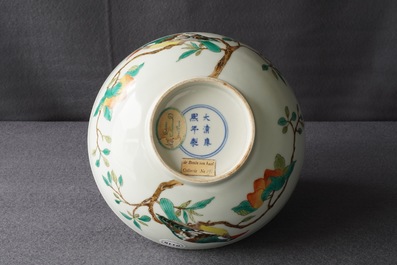 A Chinese famille verte 'birds on peach branches' bowl, Kangxi mark, 19th C.