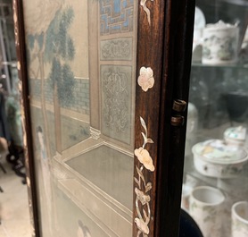 A Chinese mother-of-pearl inlaid wooden screen with silk paintings, 19th C.