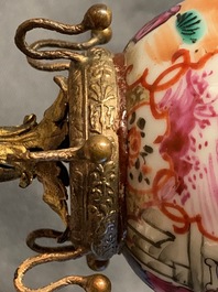 A Chinese famille rose 'mandarin' cup and saucer in gilt metal mount, Qianlong and 19th C.