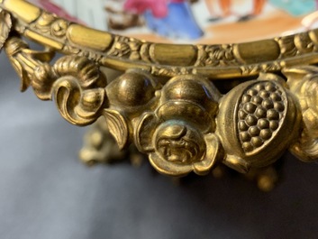 A Chinese famille rose 'mandarin' cup and saucer in gilt metal mount, Qianlong and 19th C.