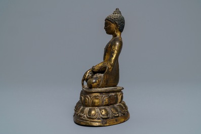 A gilt bronze figure of Buddha Shakyamuni, Tibet, 14/15th C.