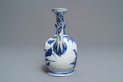 An unusual Japanese Arita blue and white jug with birds among foliage, Edo, 17th C.